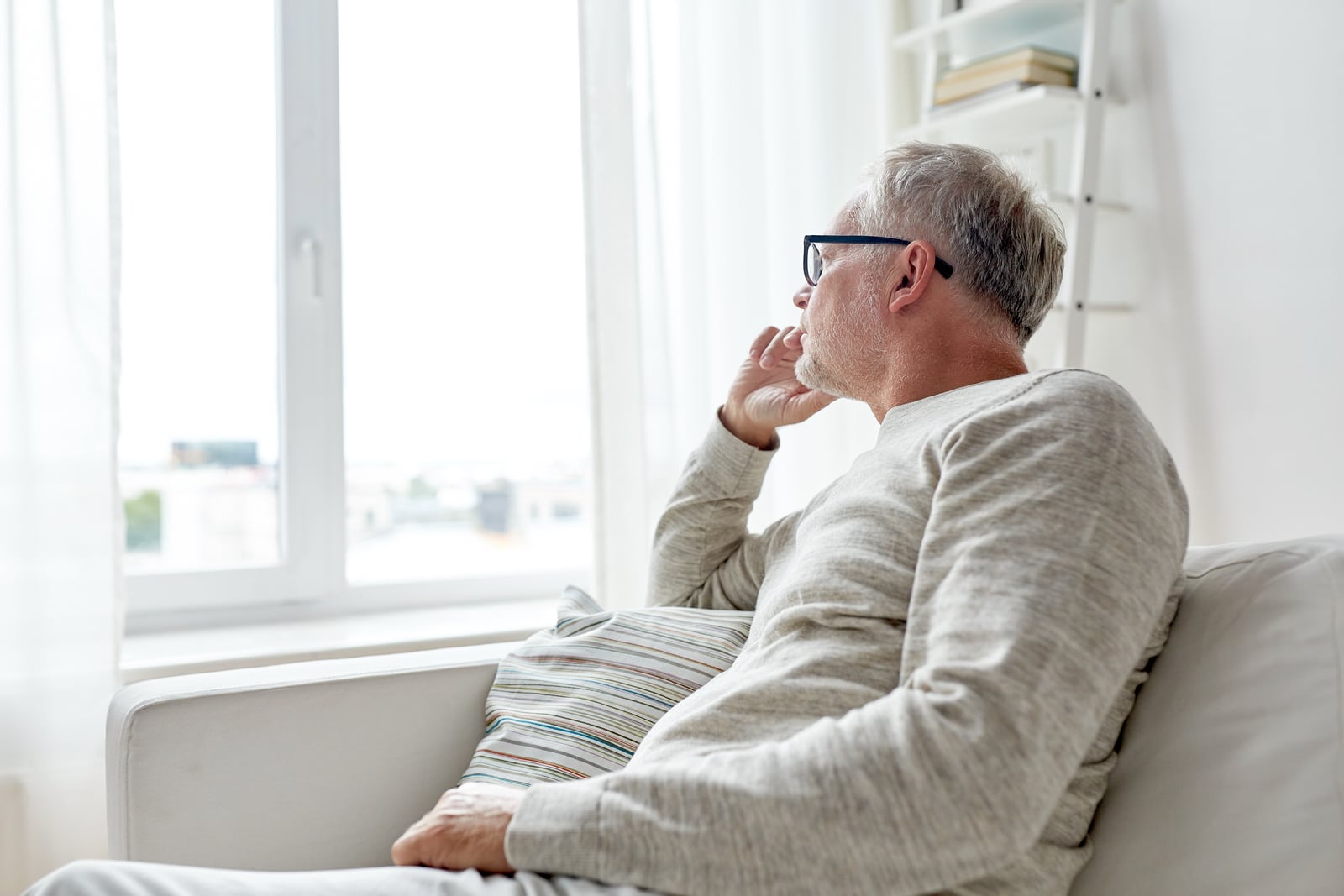 Older man wondering if his hearing loss is causing depression