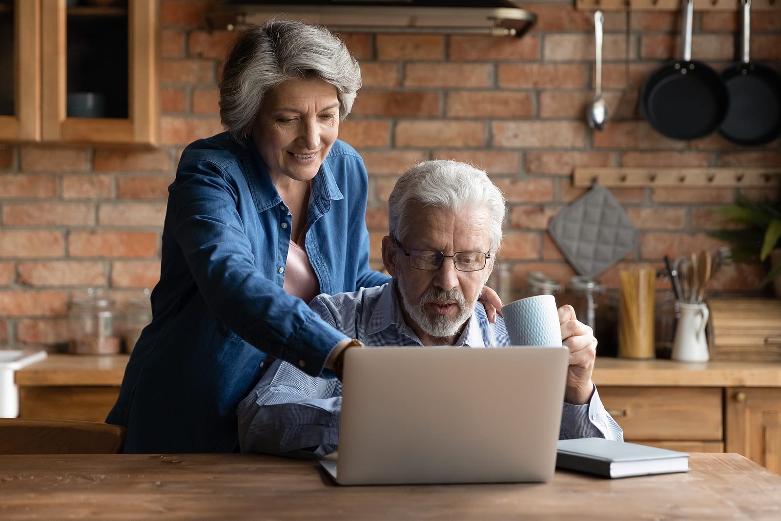 mature couple researching misconceptions about hearing loss